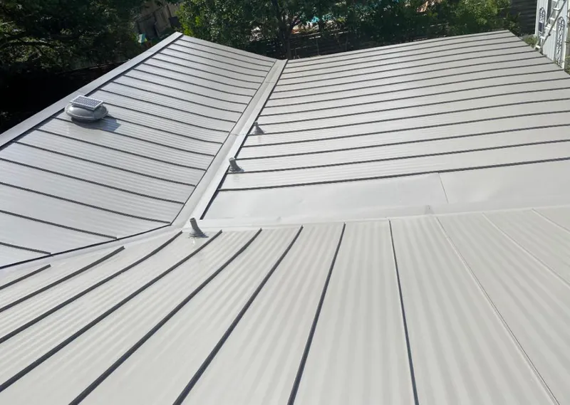 Solar attic fan installed on a metal roof for Roof Ventilation in West Chicago